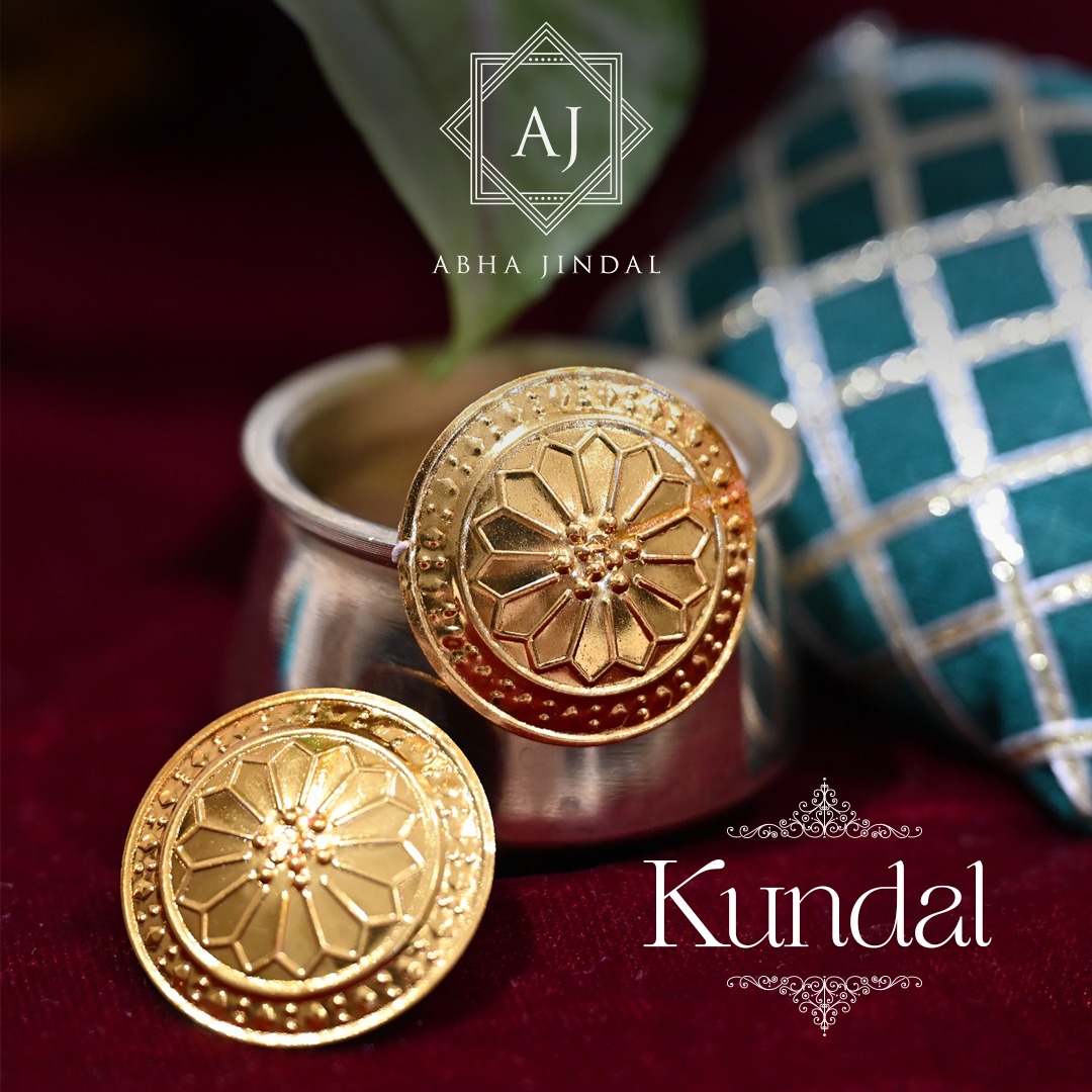 Gold Kundal, a jewellery piece.