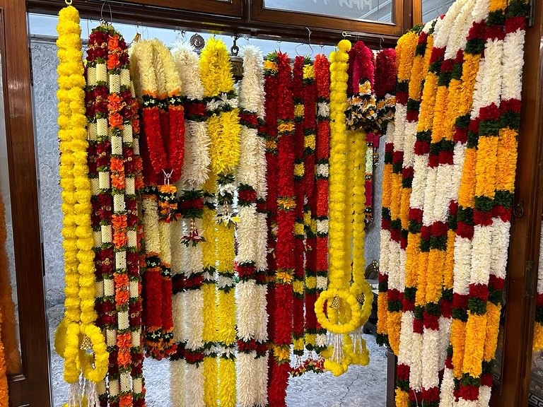 Festive Flower Garland and Bandanwar Collection, a festival décor piece, shown in a 8-image Instagram carousel. Image 1 of 8.
