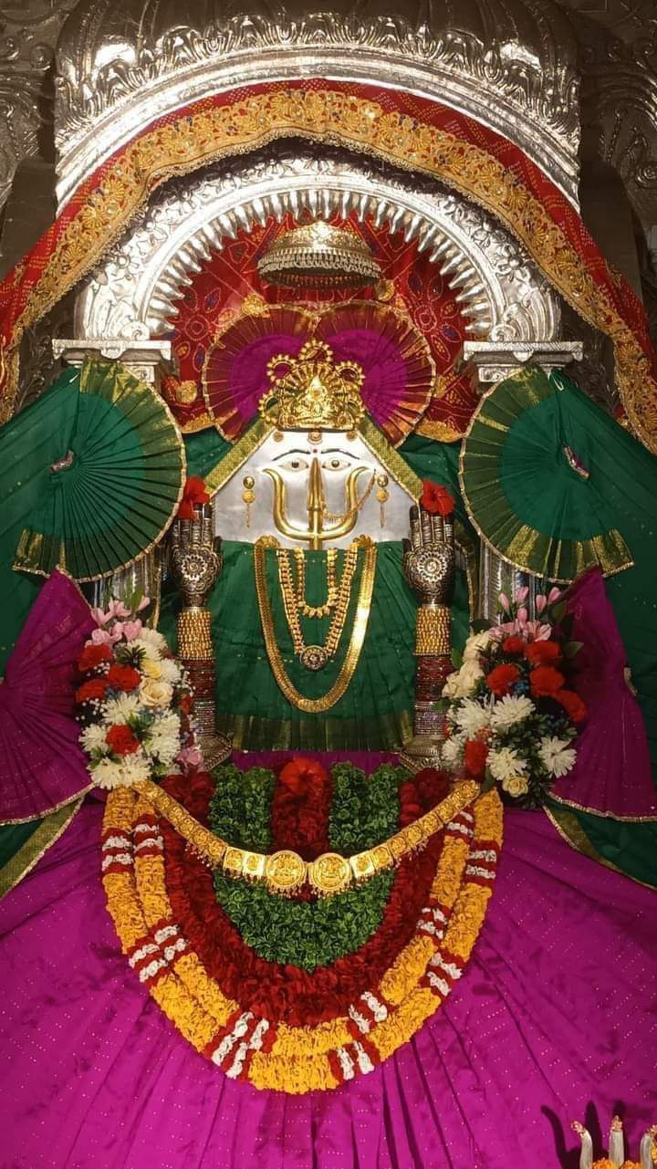 Rani Sati Dadi in magenta and green poshak with layered jewellery at Neemuch Dham.