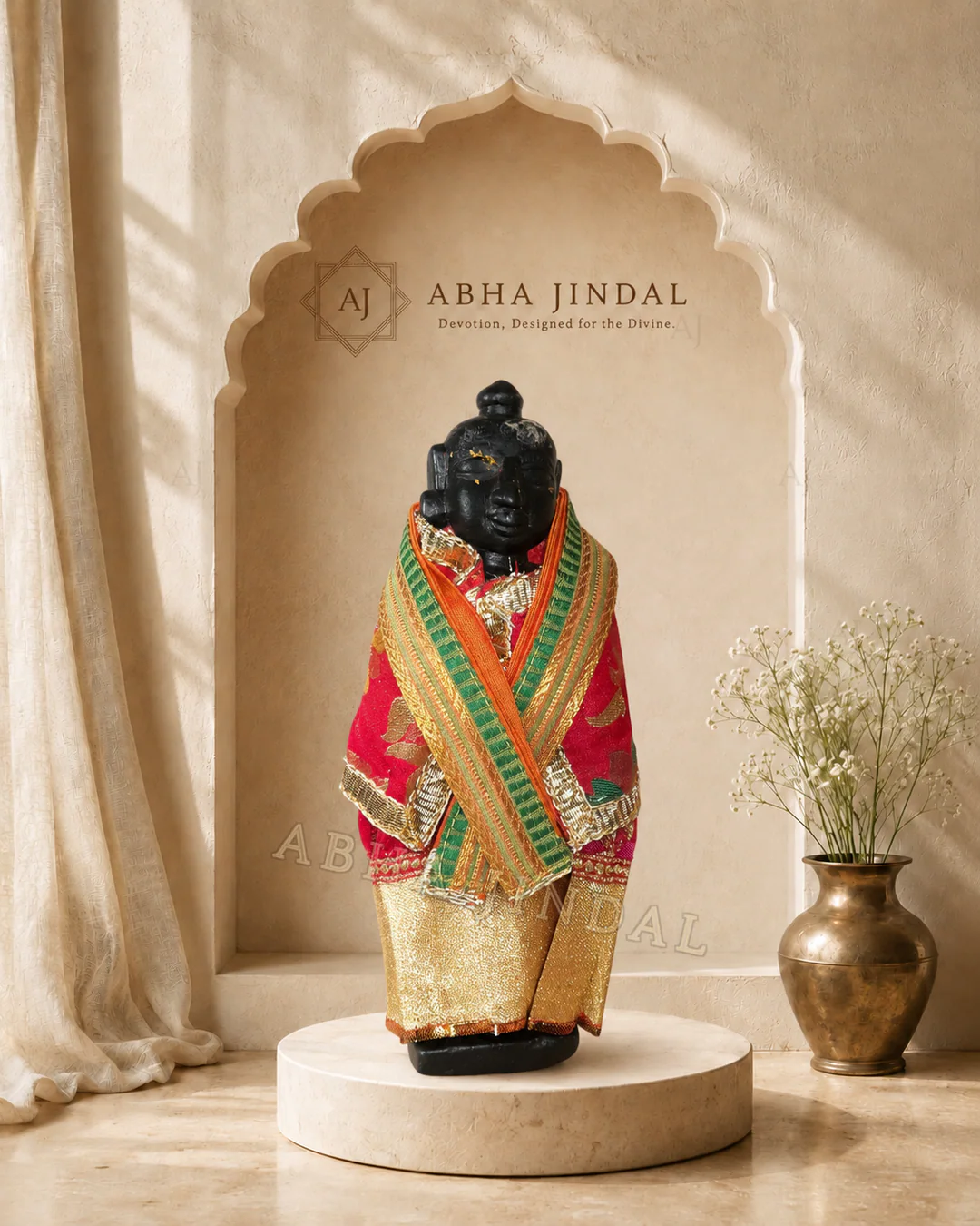 Front view of the standing Shrinathji form wrapped in crossed coral and green drapery