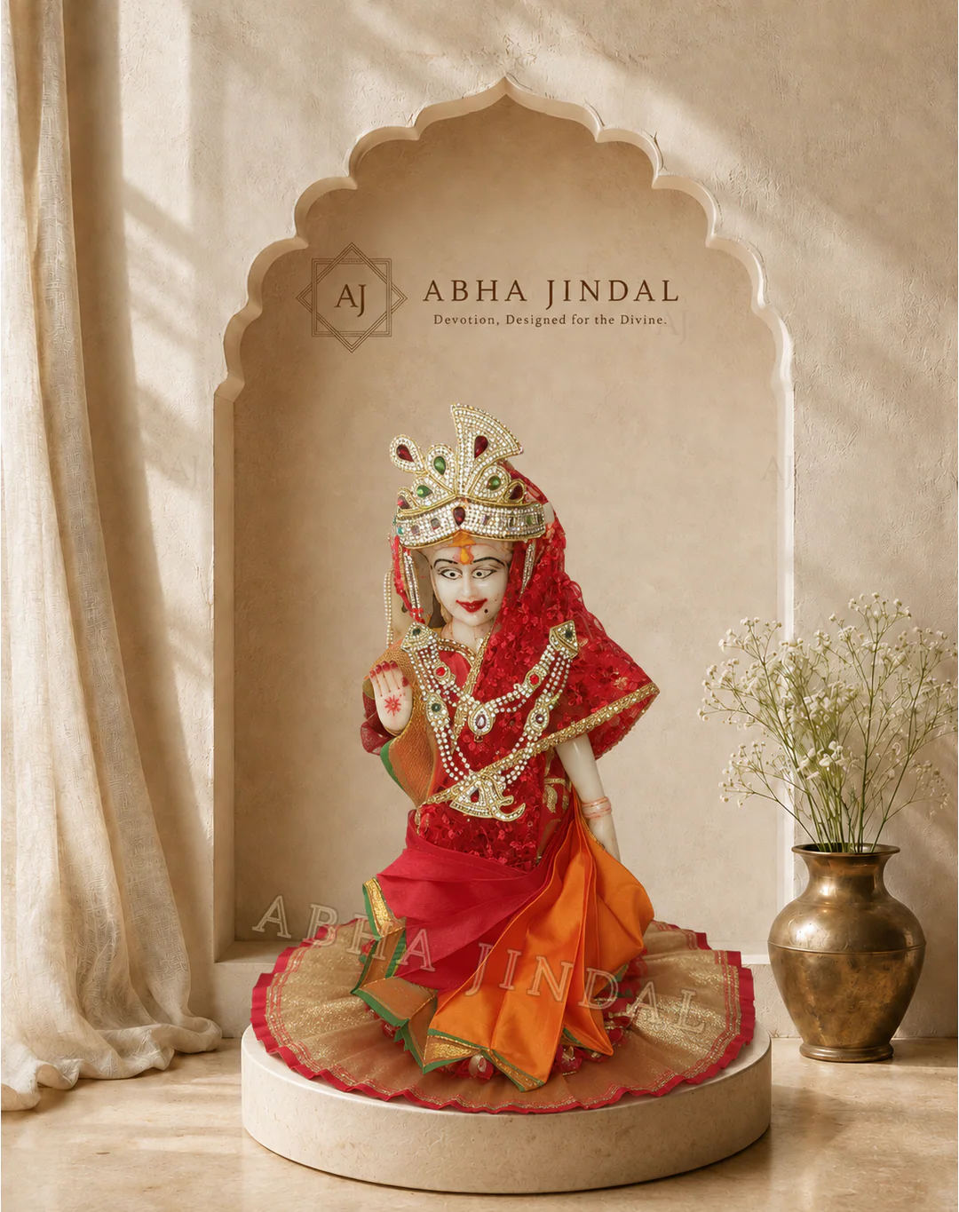 Radha Ji in a red veil and orange tiered shringar against an ivory-toned alcove, front gallery view