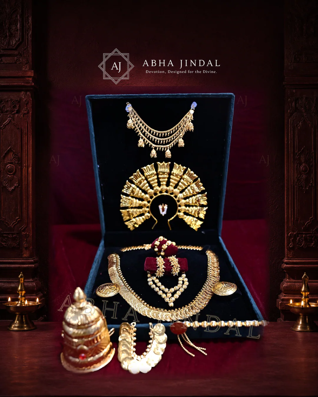 Gold-tone, pearl-white and silver-tone shringar pieces arranged in a wine display case