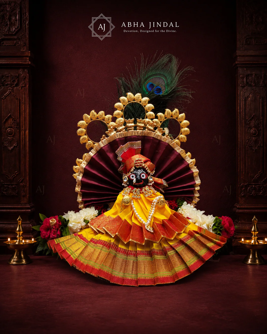 Alternate front view of orange and yellow Shrinathji shringar showing the full circular fan surround