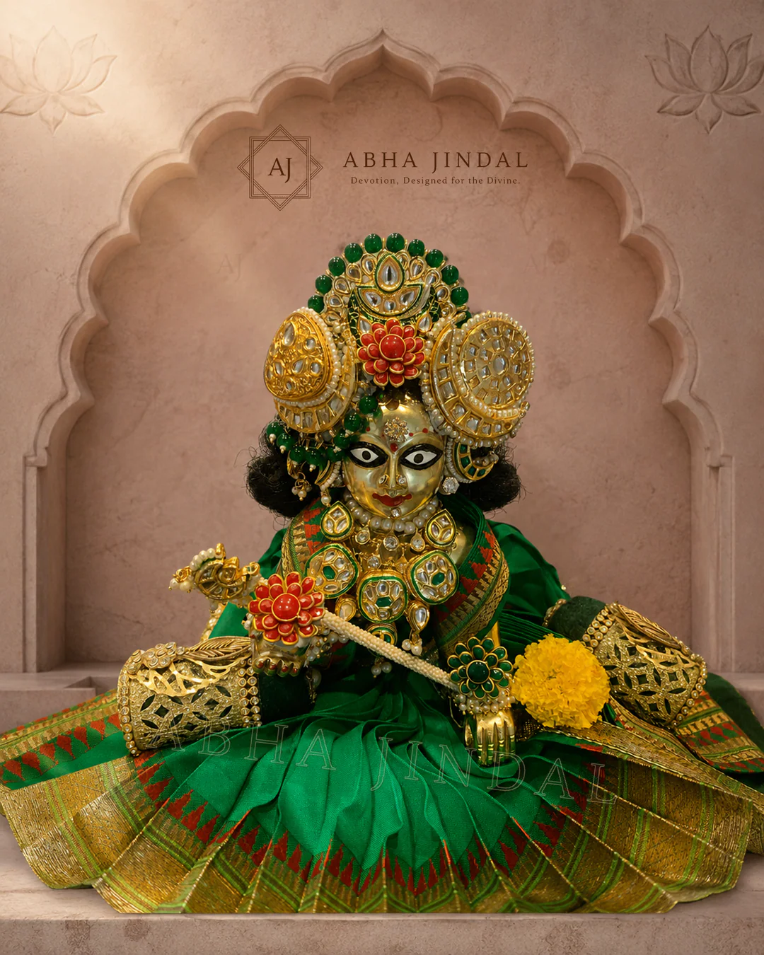 Laddu Gopal in emerald-green attire with a bansuri, broad circular skirt and green-and-yellow crown