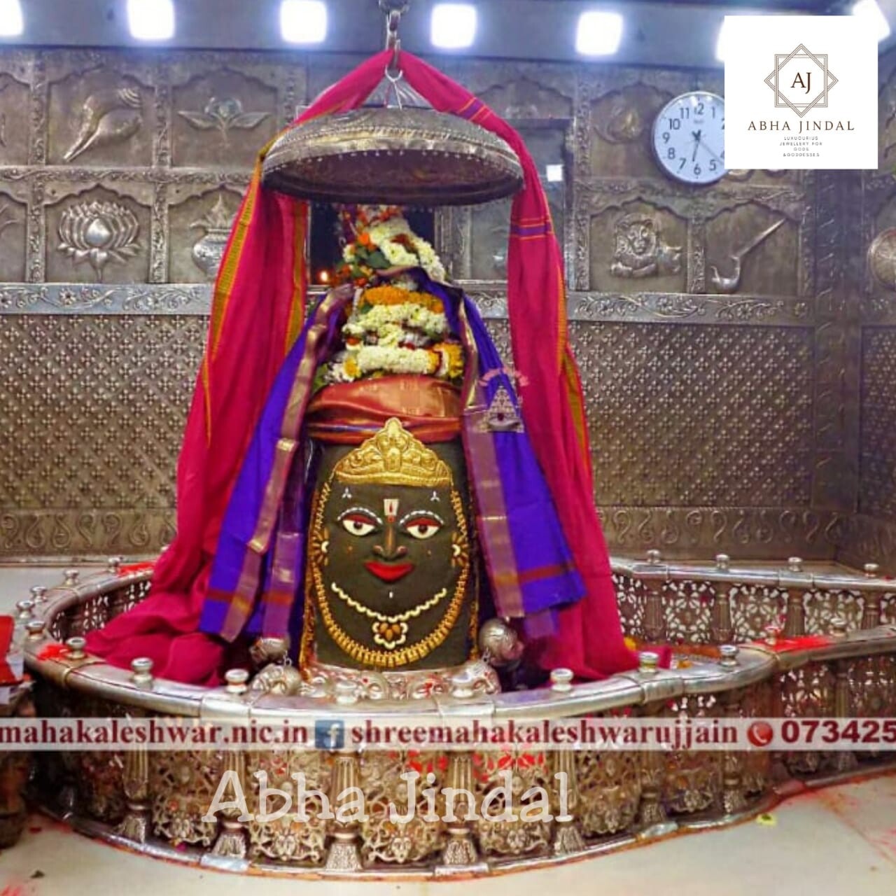 Mahakaleshwar Jyotirlinga shrine beneath a canopy with colourful textiles and flowers.
